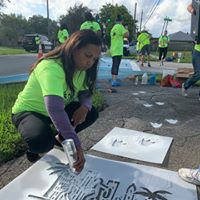 Yvette Colbourne painting sidewalk enhancement