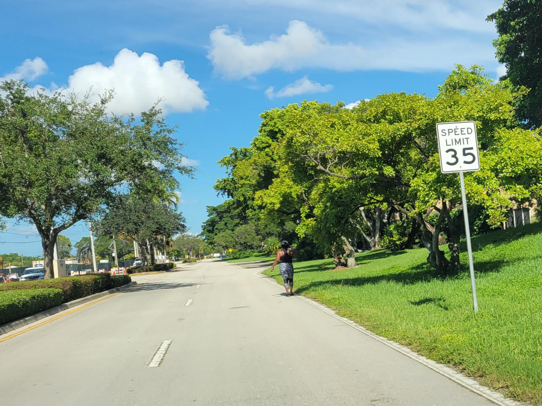 lady walking on NW 70 St